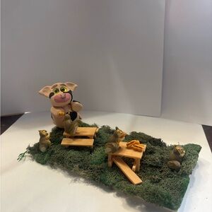 Clay cow feeding the Squirrels